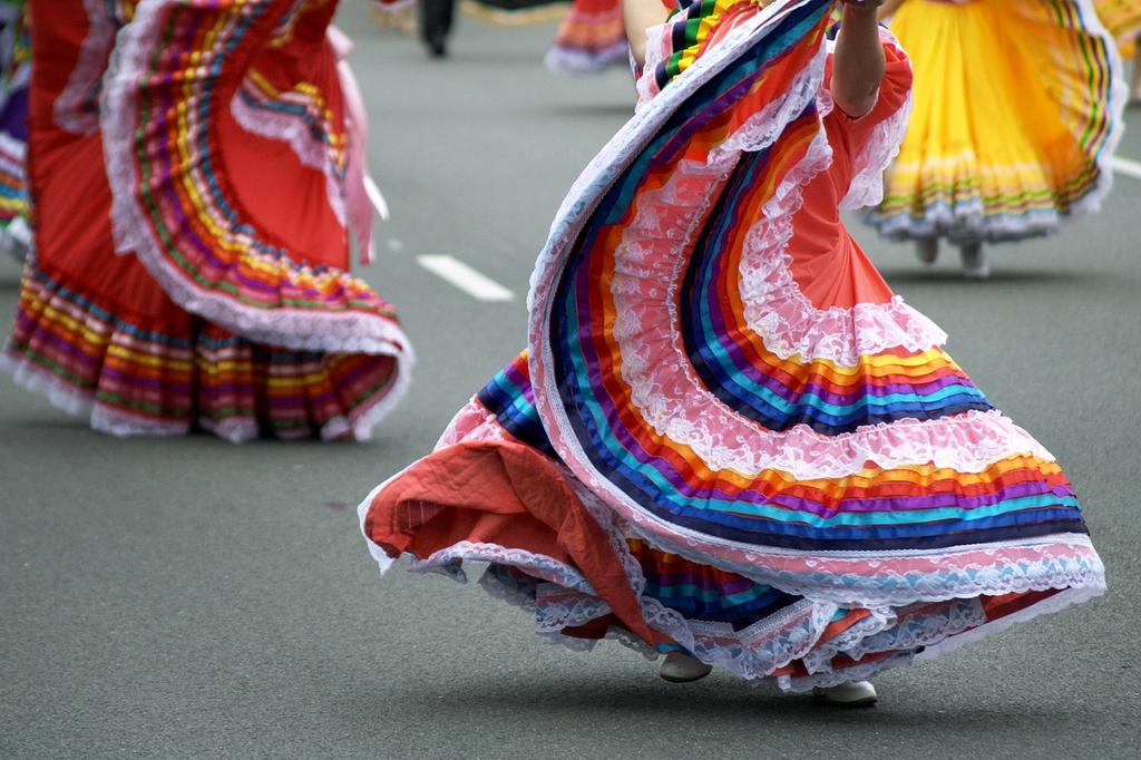 Open cultural handbook with colorful ethnic patterns
