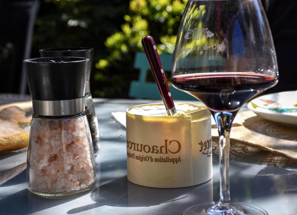 Traveler successfully navigating cultural dining experience with local family