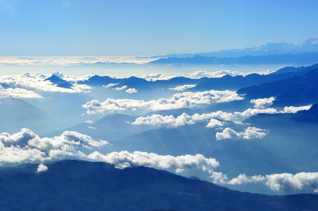 Traveler holding smartphone with language app interface